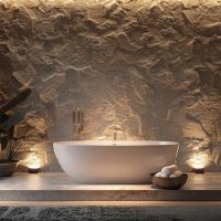 Luxury bathroom with freestanding tub. Wall-wash uplights highlight the wall texture on the left and right of the tub